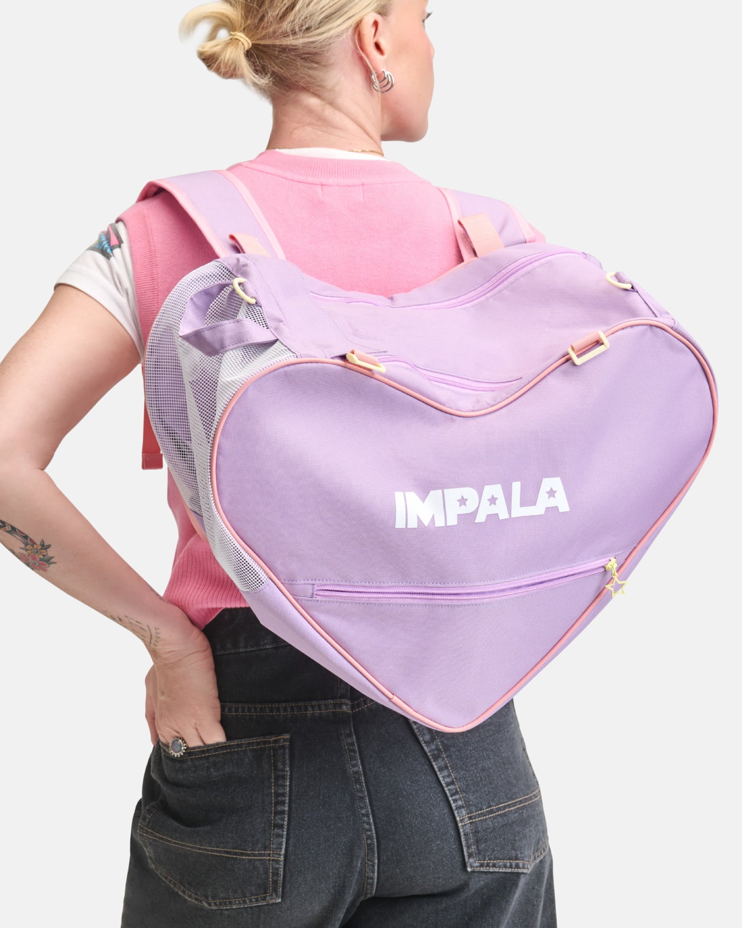 On body back view of the Impala Skate Bag - Lavender.
