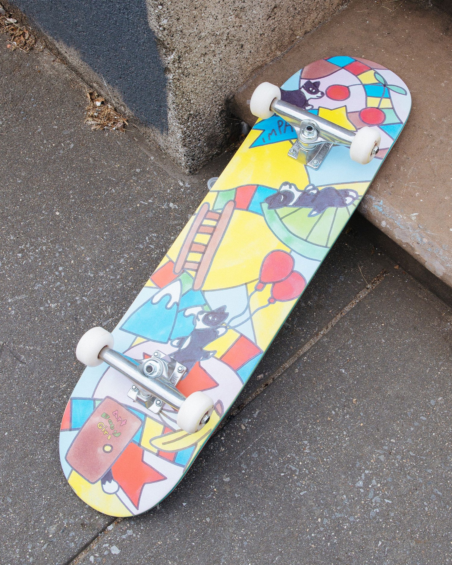 Lifestyle shot of the bottom of Impala Serpens Skateboard - Art Baby Girl
