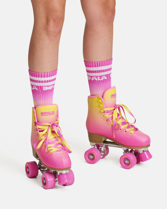 On feet front view of the Impala Quad Skate - Tropicana. 