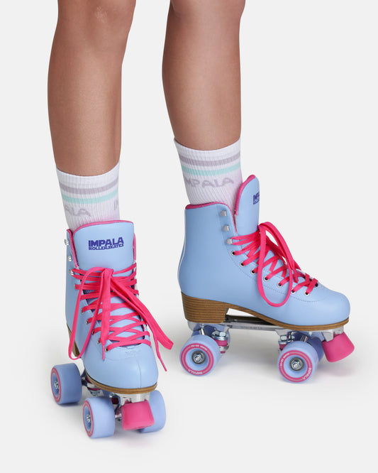 On body view of the Impala Quad Skate - Blue Raspberry. 