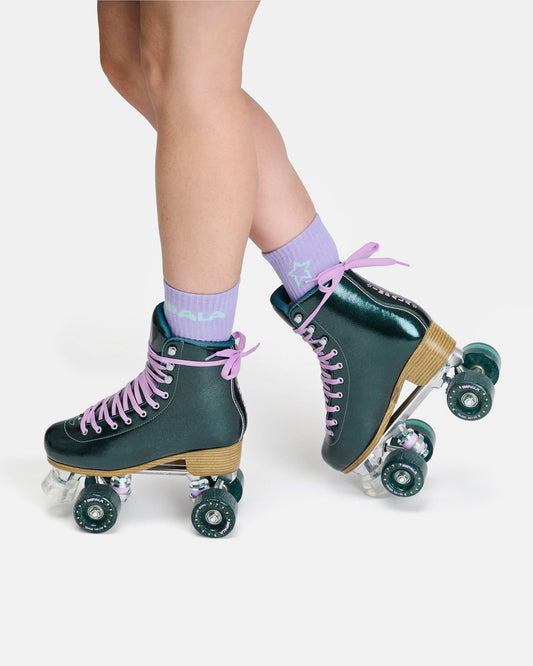 On body profile view of the Impala Quad Skate - Emerald. 