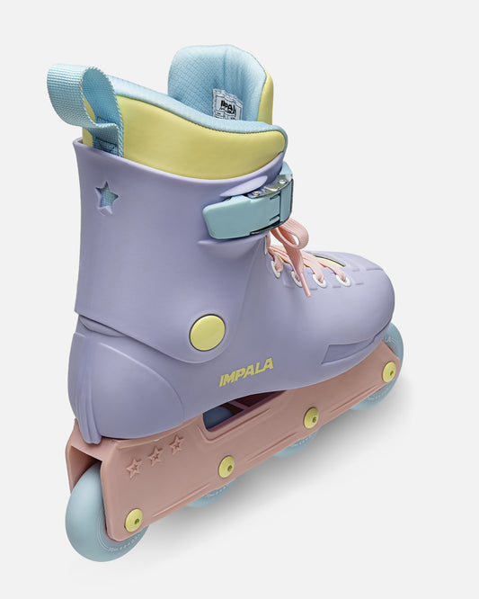 Rear view of pastel Impala Lightspeed skate showing lavender boot back, blue pull loop, and pale yellow inner panel