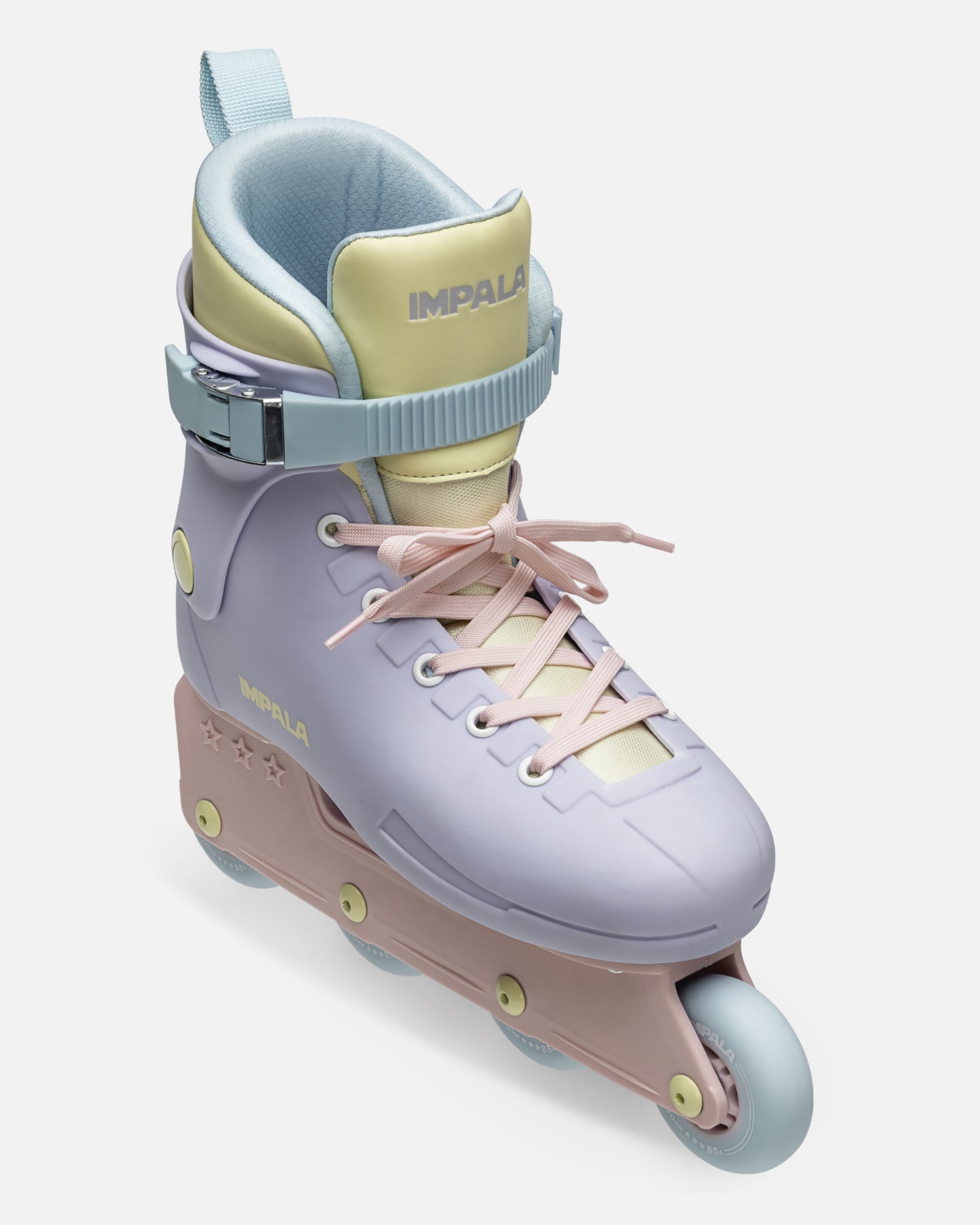 Close up of a pastel Fairy Floss inline skate ankle boot with yellow and light blue panels and a secure strap