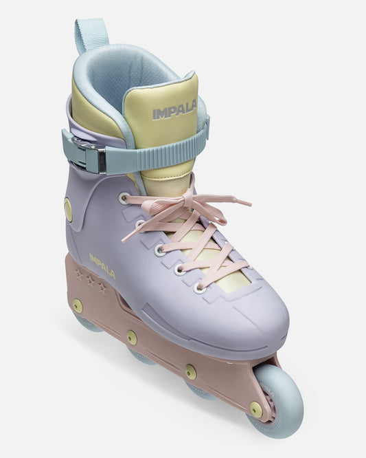 Close up of a pastel Fairy Floss inline skate ankle boot with yellow and light blue panels and a secure strap