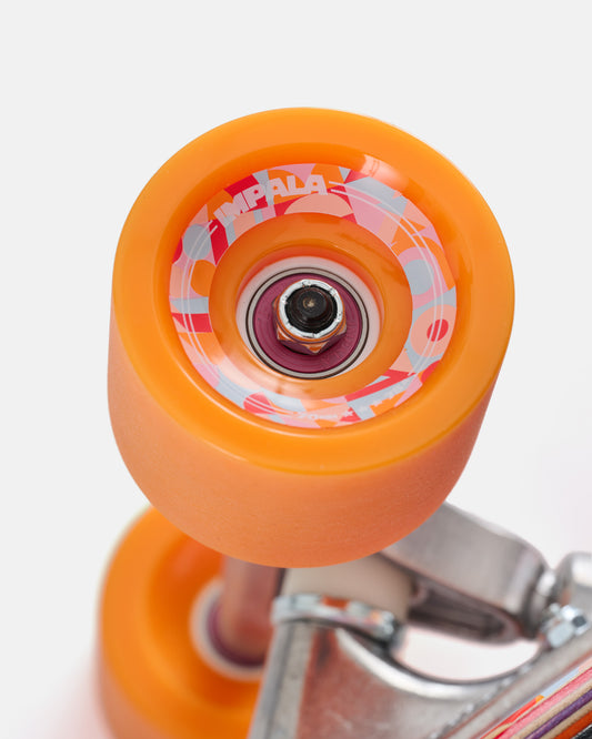 Bright orange longboard wheel with pink gray graphic and central bearing