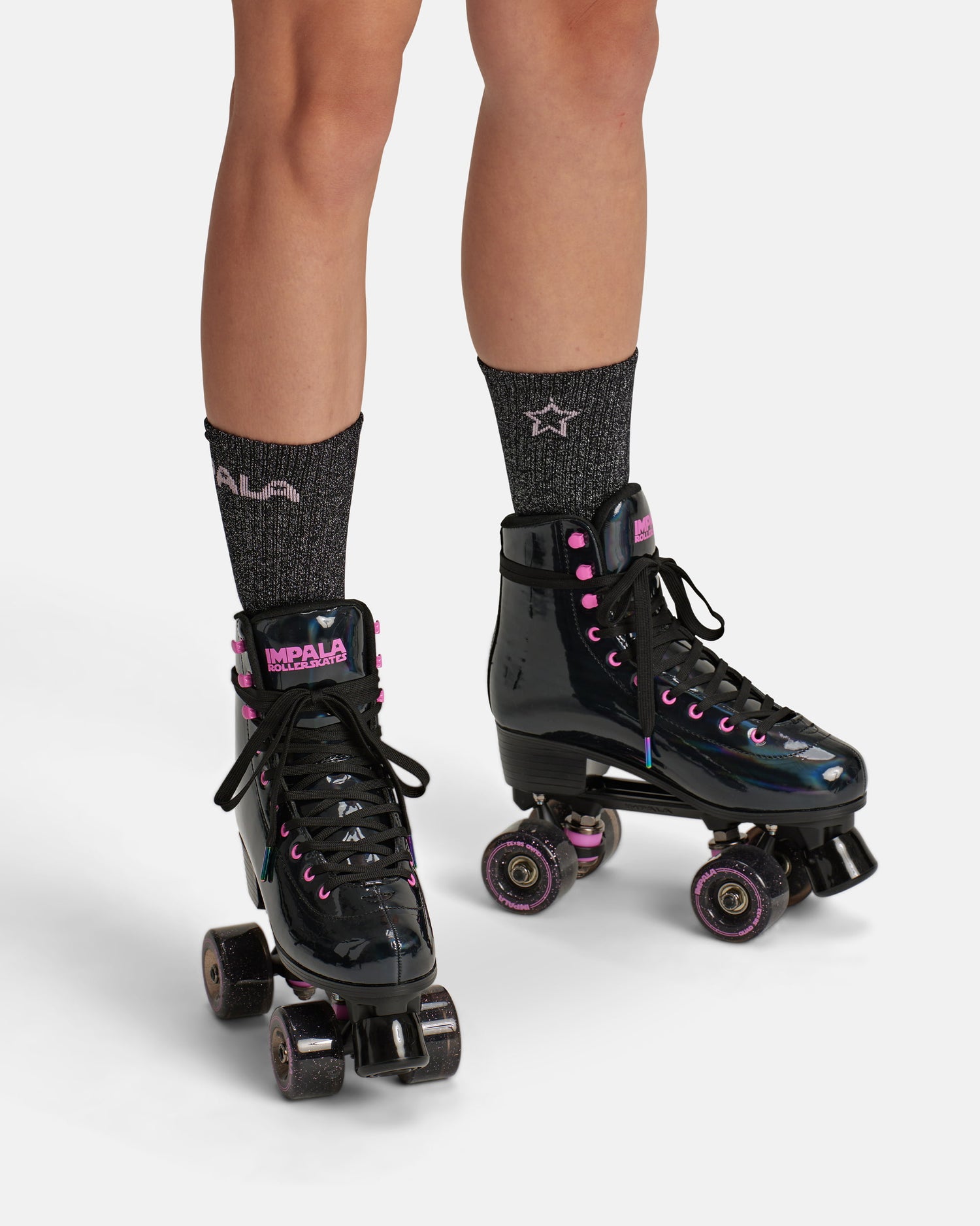 On body front of the Impala Quad Skate - Black Holographic