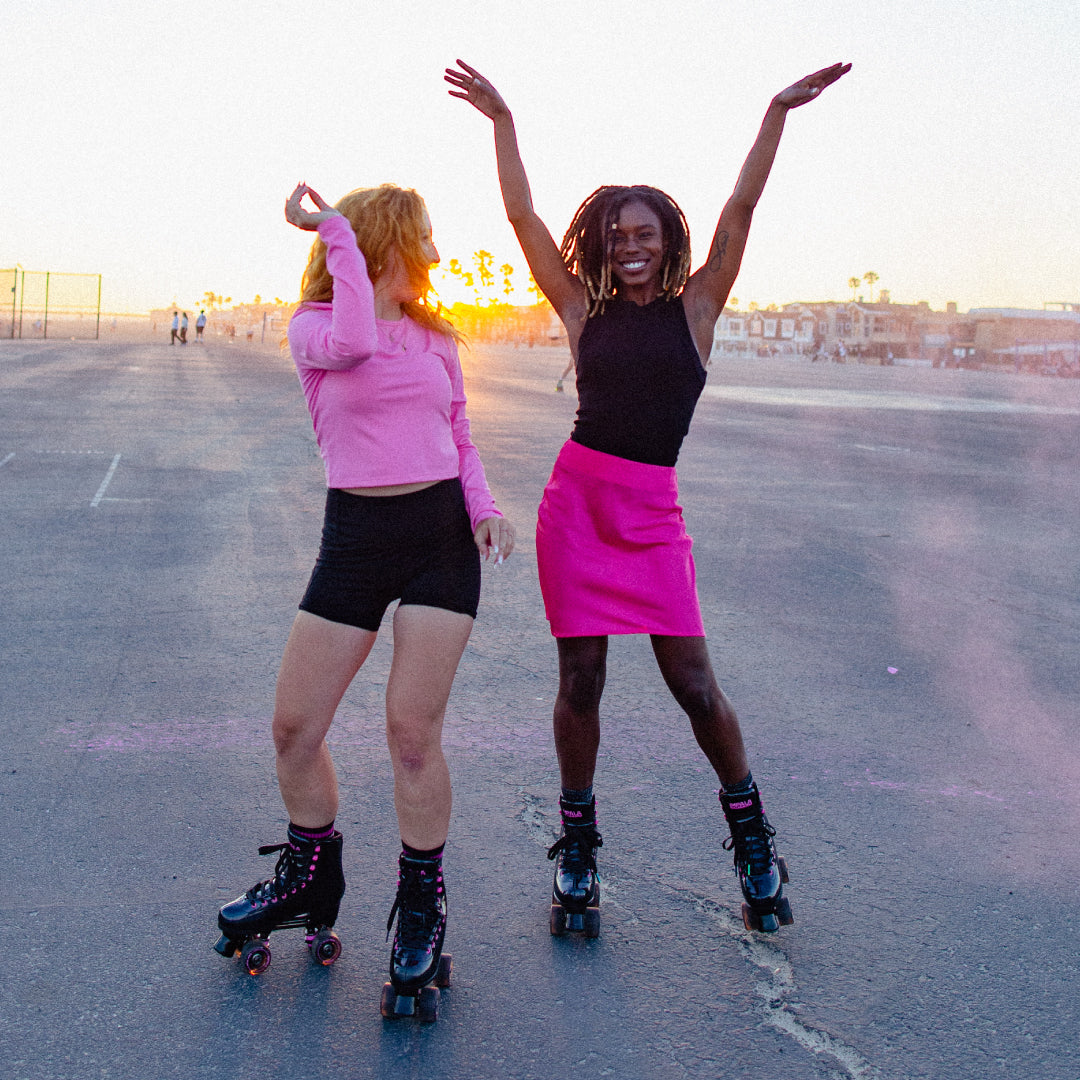 2 girls skating impala black holo quads 