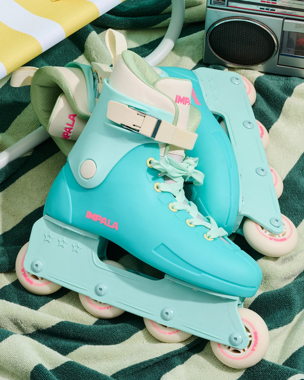Seafoam blue Impala Lightspeed inline skate with aqua shell and padded liner in a close up shot