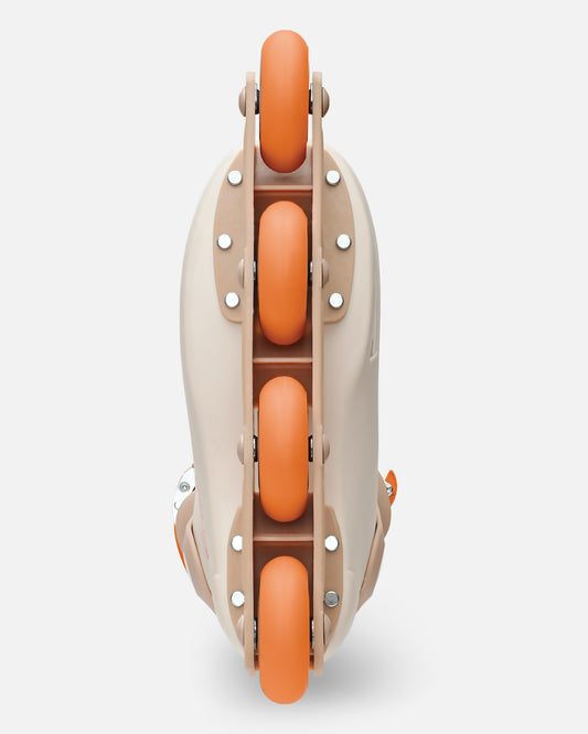 Overhead view of Sahara inline skate with orange wheels along the center frame