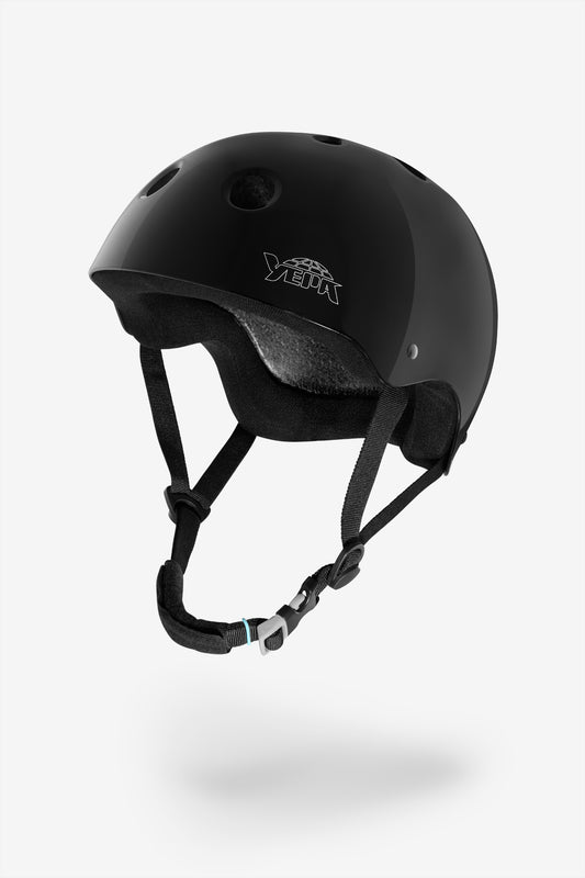 Black helmet with chin strap on a white background
