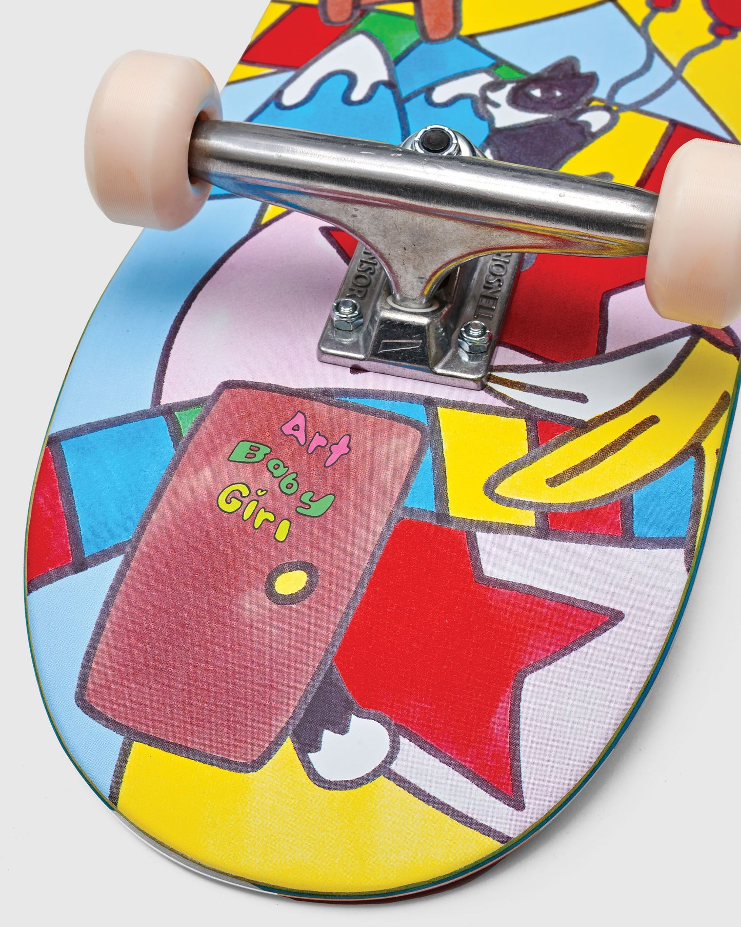 Graphic detailing and truck detailing of Impala Serpens Skateboard - Art Baby Girl