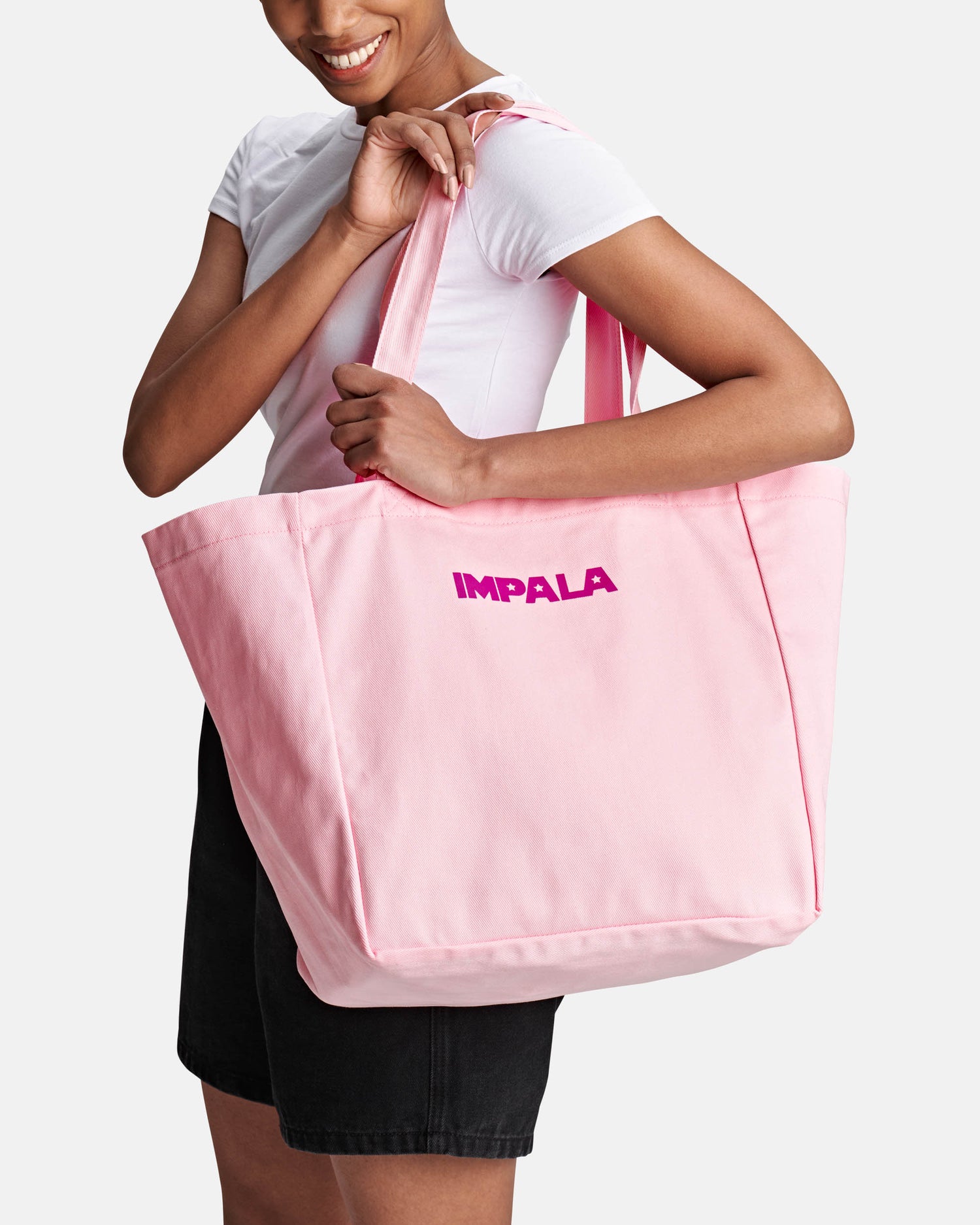 model wearing Impala Skate Pink Tote Bag