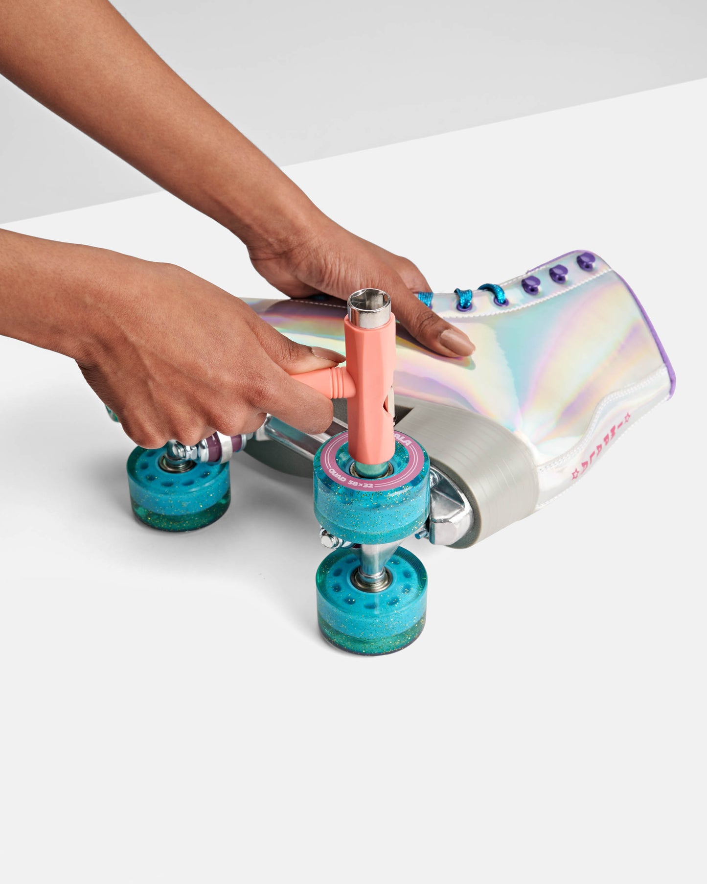 installing blue holographic transparent impala roller skate wheels 